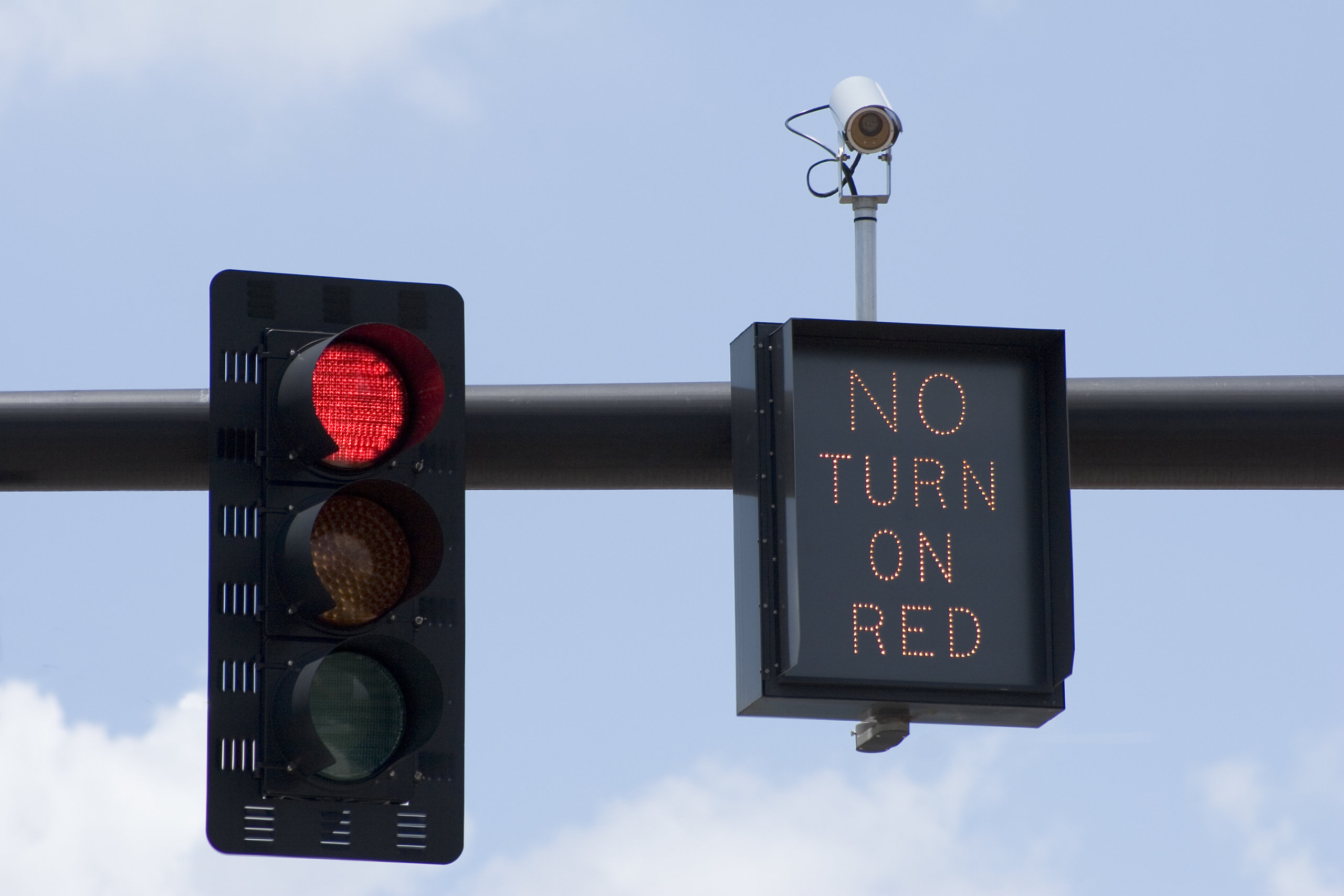 Red light camera with no turn on red sign.